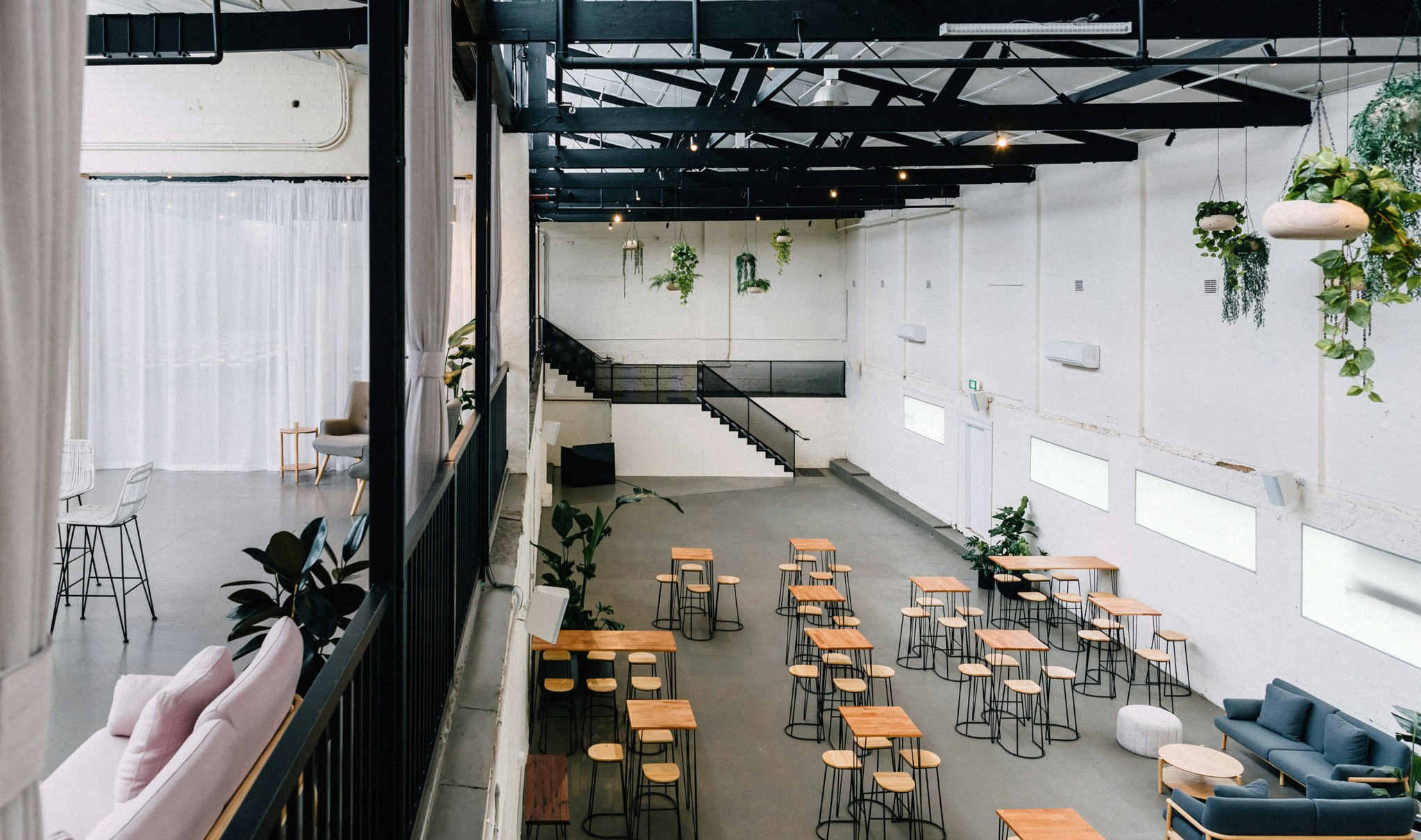 Overlooking a vast warehouse space setup for an event.